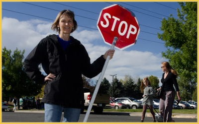 Angie at the cross walk in front of Fireside Elementary